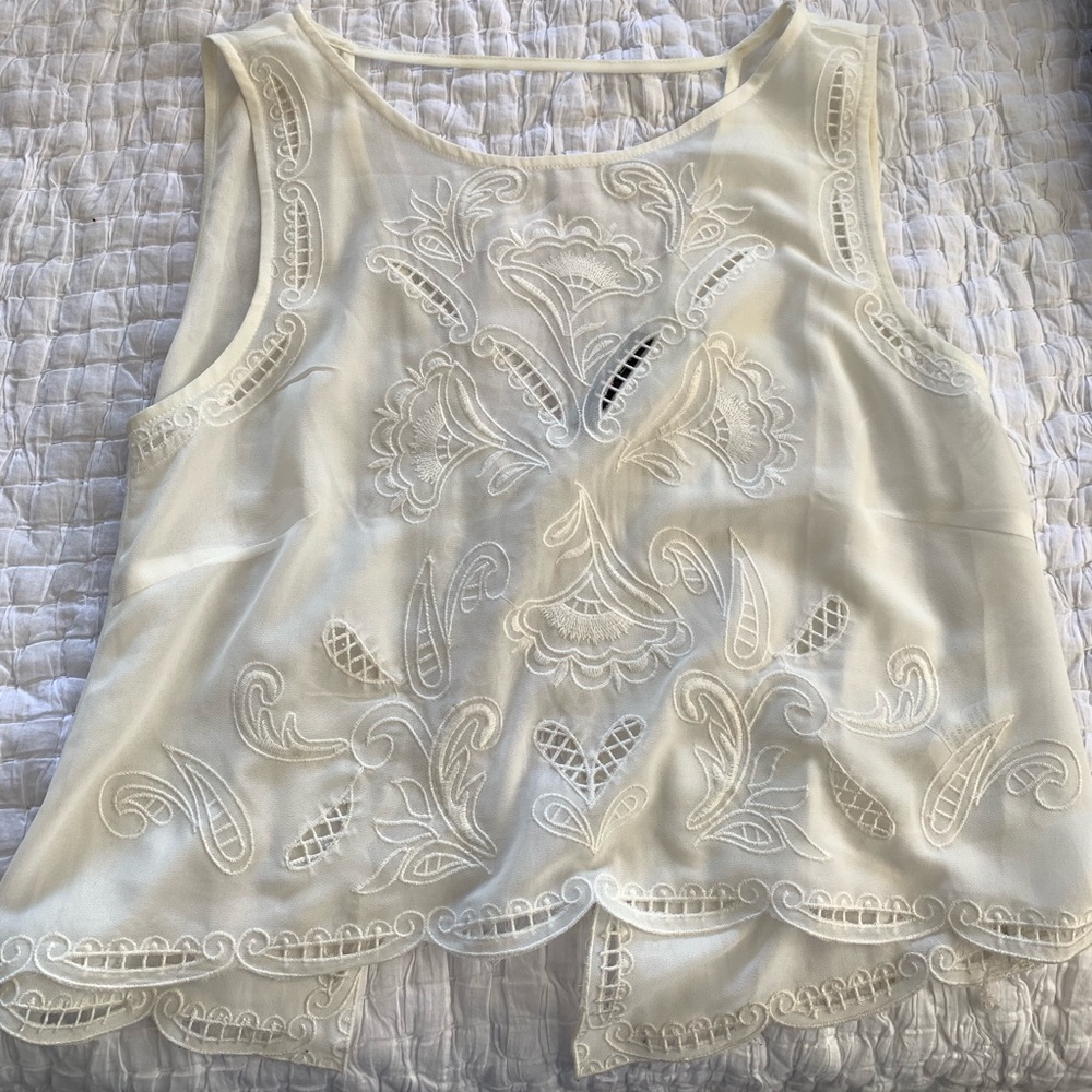 Elegant patterned cream top